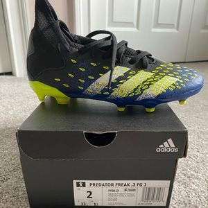 Adidas soccer cleats size 2 little kids worn twice comes with shin guards